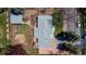This aerial view shows a backyard with garden, grey roof, deck, patio, and yard at 12375 W 19Th Pl, Lakewood, CO 80215