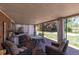 Inviting covered patio with comfortable seating, a dining table, and a built-in grill at 12375 W 19Th Pl, Lakewood, CO 80215