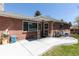 Inviting front entrance with brick facade, covered porch, and decorative security door at 12375 W 19Th Pl, Lakewood, CO 80215