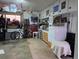 Organized garage space featuring ample storage, workbench area, and room for hobbies and parking at 12375 W 19Th Pl, Lakewood, CO 80215