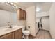 Bathroom featuring single sink vanity and separate area for laundry at 2789 Decatur Dr, Broomfield, CO 80020