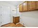 Mud room features wood cabinets, a built-in shelf, and a door that leads to the outside at 640 N 15Th Ave, Brighton, CO 80601