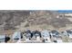 A wide aerial view of a new home development, featuring mountain views at 865 Oleander St, Castle Rock, CO 80109