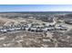 A wide aerial shot of a housing development set against a backdrop of mountain vistas at 865 Oleander St, Castle Rock, CO 80109