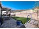 Spacious backyard includes a covered patio, dining area, artificial turf, and hillside views for outdoor enjoyment at 865 Oleander St, Castle Rock, CO 80109