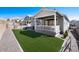 Backyard with artificial turf, a patio, a covered porch, and privacy fence at 865 Oleander St, Castle Rock, CO 80109