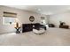 Basement space is complete with a comfortable sectional, stylish decor, and plenty of natural light from the windows at 865 Oleander St, Castle Rock, CO 80109