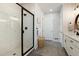 Modern bathroom with a glass-enclosed shower, white subway tile, and matte black fixtures, creating a clean, sophisticated look at 865 Oleander St, Castle Rock, CO 80109