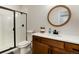 Modern bathroom with a glass-enclosed shower, single sink vanity, and stylish fixtures at 865 Oleander St, Castle Rock, CO 80109