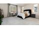 Cozy bedroom with a large window, comfortable bed, study desk, and soft carpet, perfect for relaxation and work at 865 Oleander St, Castle Rock, CO 80109