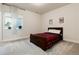 This bedroom has a wooden bed frame, a plaid blanket, a window and an upper ledge at 865 Oleander St, Castle Rock, CO 80109