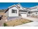 Well-maintained single-Gathering home featuring manicured front lawn and gray and white facade at 865 Oleander St, Castle Rock, CO 80109