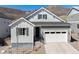 Charming single-Gathering home featuring a white garage door and a manicured, minimalist front yard at 865 Oleander St, Castle Rock, CO 80109