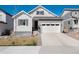 Well-maintained single-Gathering home featuring manicured front lawn and gray and white facade at 865 Oleander St, Castle Rock, CO 80109