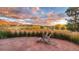 Inviting back patio with stone floor, wood chairs and gorgeous mountain views with lush landscaping at 9 Amaranth Dr, Littleton, CO 80127