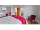 Comfortable bedroom featuring hardwood floors and access to an ensuite bathroom at 9 Amaranth Dr, Littleton, CO 80127