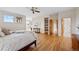 Bright, airy bedroom with hardwood floors and access to ensuite bathroom at 9 Amaranth Dr, Littleton, CO 80127