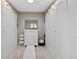 Spacious walk-in closet featuring custom shelving, dresser, and ample storage space at 9 Amaranth Dr, Littleton, CO 80127