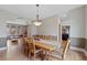 Elegant dining room featuring hardwood floors, a stylish chandelier, and easy access to the living areas at 9 Amaranth Dr, Littleton, CO 80127