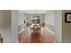 Elegant dining room featuring hardwood floors, decorative lighting and large windows with backyard views at 9 Amaranth Dr, Littleton, CO 80127