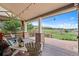 Covered porch with outdoor seating and scenic view at 9 Amaranth Dr, Littleton, CO 80127