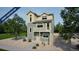 Modern two-story home with a front balcony and charming architectural details under construction at 46534 Avery Ln, Bennett, CO 80102