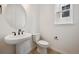 Bathroom with pedestal sink, modern fixtures, and neutral paint at 24768 E 40Th Ave, Aurora, CO 80019