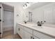 Elegant bathroom with double vanity, modern fixtures, and a separate shower and toilet area at 24768 E 40Th Ave, Aurora, CO 80019