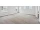Bright bedroom featuring neutral carpet, white walls, and multiple windows for ample natural light at 24768 E 40Th Ave, Aurora, CO 80019