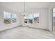Bright dining area with lots of windows and an elegant chandelier at 24768 E 40Th Ave, Aurora, CO 80019