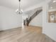 Spacious living area featuring a staircase, wood flooring, and contemporary design at 24768 E 40Th Ave, Aurora, CO 80019