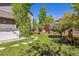Relaxing backyard with hot tub, patio area with outdoor seating, and serene landscaping at 4875 E 117Th Dr, Thornton, CO 80233