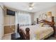 Well-lit bedroom with ceiling fan, tv, large window and comfortable queen bed at 4875 E 117Th Dr, Thornton, CO 80233