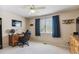 Cozy bedroom featuring a ceiling fan, neutral carpet, and a large window with lots of natural light at 4875 E 117Th Dr, Thornton, CO 80233