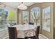 Charming dining area featuring a round table, large windows, and natural light at 4875 E 117Th Dr, Thornton, CO 80233