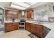 Spacious kitchen featuring stainless steel appliances and dark wood cabinetry at 4875 E 117Th Dr, Thornton, CO 80233