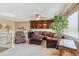 Relaxing living area with a comfortable sectional sofa and a built-in bookshelf at 4875 E 117Th Dr, Thornton, CO 80233