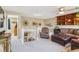 Upstairs living area with staircase, comfortable furniture and a built-in bookshelf at 4875 E 117Th Dr, Thornton, CO 80233