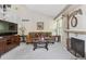Inviting living room with a fireplace and a staircase leading to the upper level at 4875 E 117Th Dr, Thornton, CO 80233