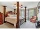Elegant main bedroom with a four-poster bed, soft carpeting, and plenty of natural light at 4875 E 117Th Dr, Thornton, CO 80233