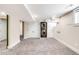 Finished basement with plush carpet, a stackable washer and dryer, and plenty of storage space at 315 S Franklin St, Denver, CO 80209