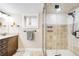 Bright bathroom featuring a glass enclosed shower, modern fixtures, and a classic vanity for a spa-like experience at 315 S Franklin St, Denver, CO 80209