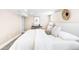 Brightly lit bedroom featuring neutral tones, carpeted floors, and a minimalist aesthetic for relaxation and comfort at 315 S Franklin St, Denver, CO 80209