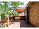 Wooden deck with awning shows outdoor living with a wooden railing and access to outdoor area at 315 S Franklin St, Denver, CO 80209
