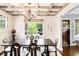 Elegant dining room features coffered ceiling, hardwood floors, and a modern chandelier at 315 S Franklin St, Denver, CO 80209