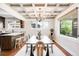 Dining room with a coffered ceiling, a chandelier, and large windows overlooking the yard at 315 S Franklin St, Denver, CO 80209