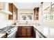 Kitchen with granite countertops, stainless steel appliances, and warm wood cabinetry provides a cooking space at 315 S Franklin St, Denver, CO 80209