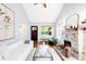 Inviting living room with a stone fireplace, hardwood floors, and a comfortable white sofa at 315 S Franklin St, Denver, CO 80209