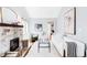 Bright living room featuring a stone fireplace, hardwood floors, and a comfortable seating area at 315 S Franklin St, Denver, CO 80209