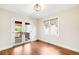 Bright room showcasing beautiful hardwood floors, white trim, and stylish double doors leading to a deck at 315 S Franklin St, Denver, CO 80209